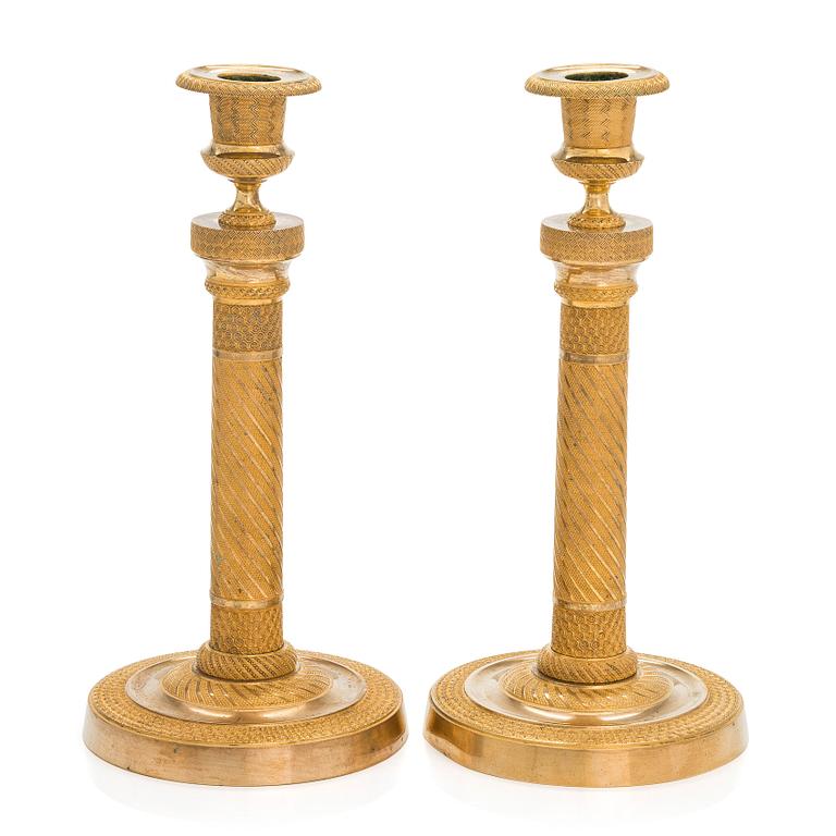 A pair of  French gilded Empire candlesticks, early 19th century.