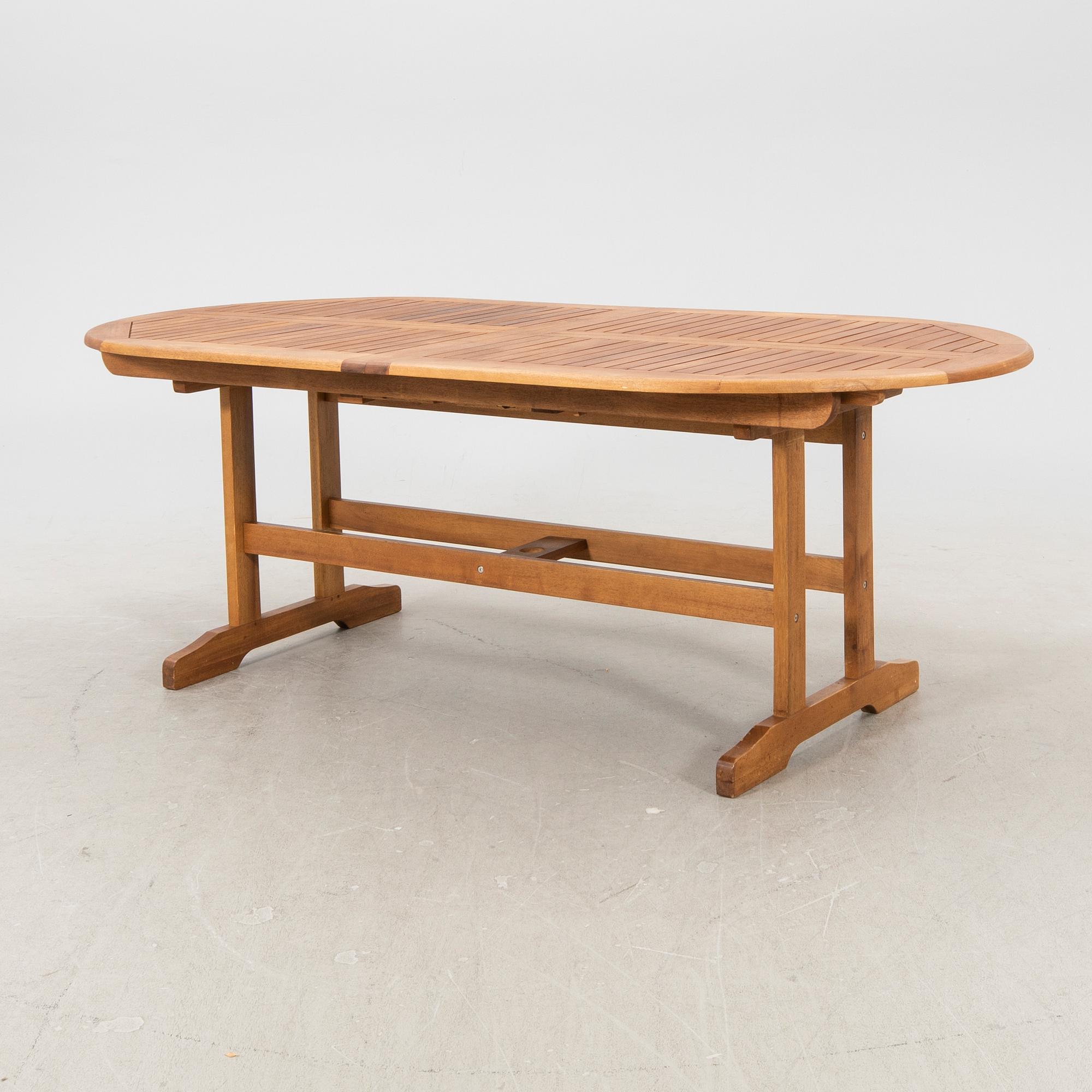A 9 pcs stained teak garden suite by Brafab around 2000.