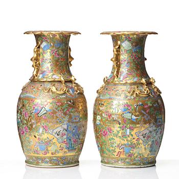 A pair of famille rose Canton vases, Qing dynasty, 19th Century.