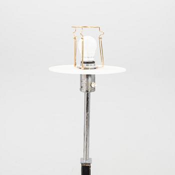 A Philips leather and chrome floor lamp model no 590A later part of the 20th century.