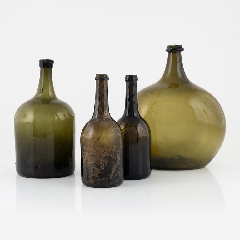 Four glass bottles, 18th/19th century.