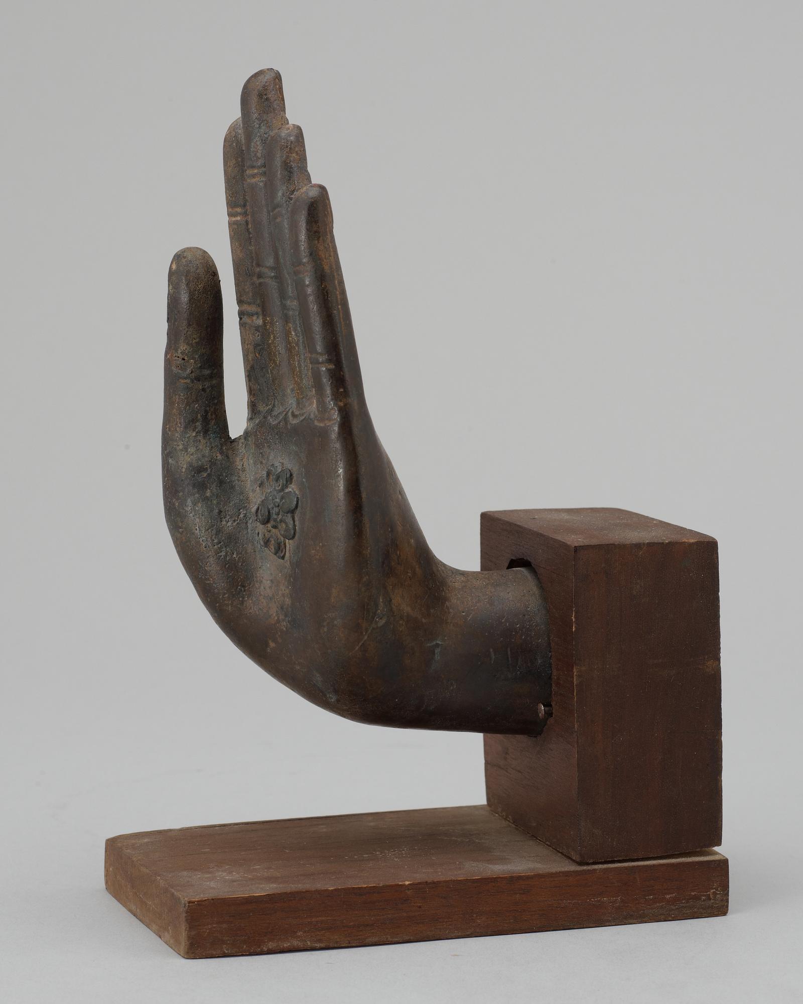A  Thai bronze Buddha hand.