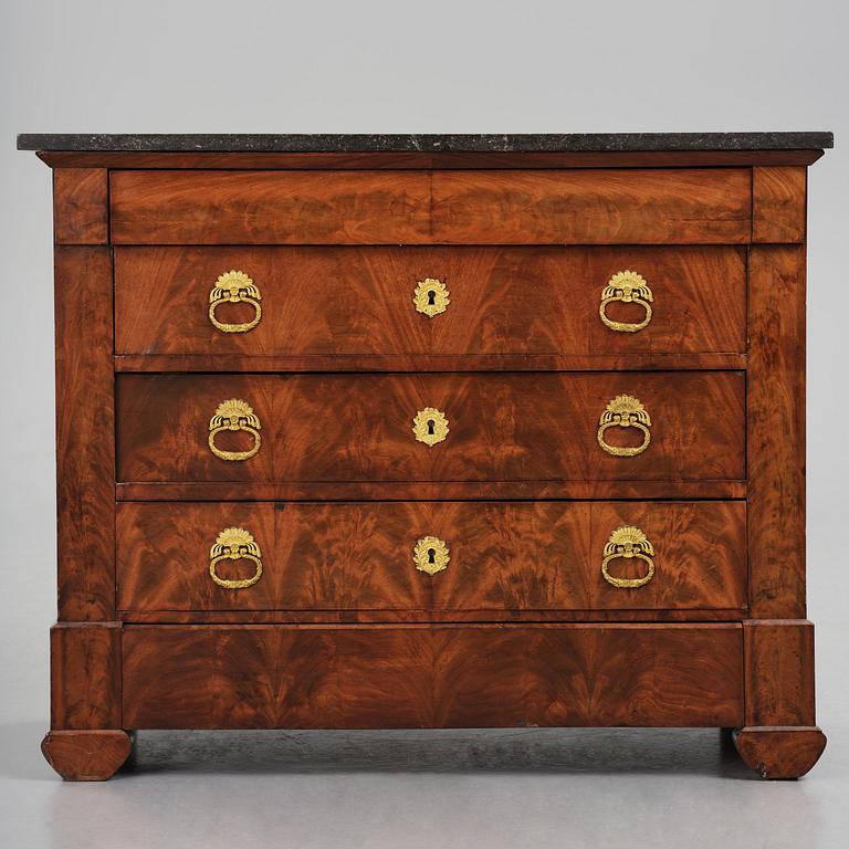 A French Empire mahogany commode, early 19th century.