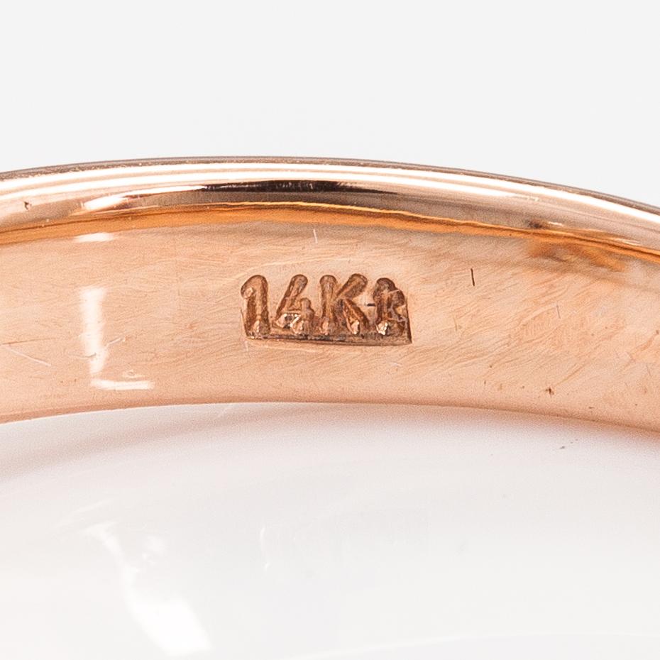 A 14K rose gold ring with a ca. 0.87 ct light brown diamond.
