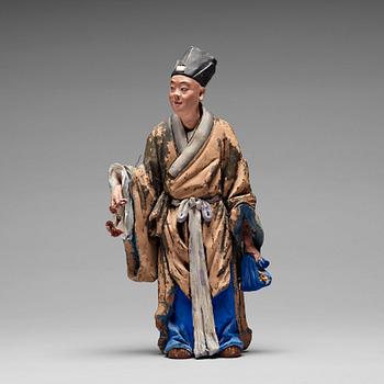 181. A clay figure of a chinese man, Qing dynasty, 19th Century.