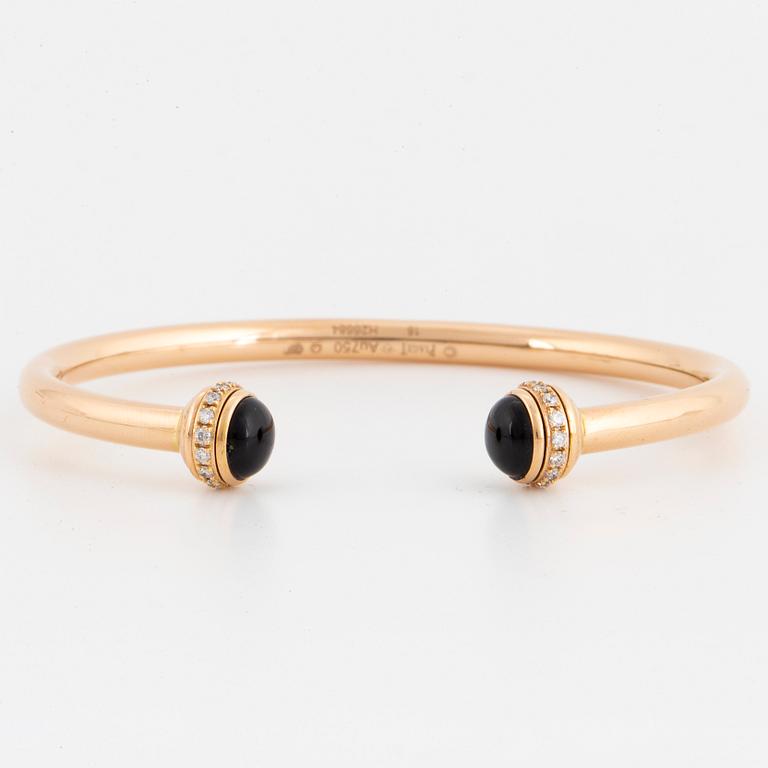 Piaget 18K rose gold, brilliant-cut diamonds and onyx cabochons.