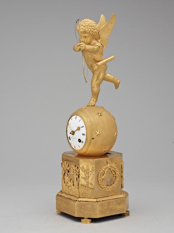 An Empire early 19th Century gilt bronze mantel clock.