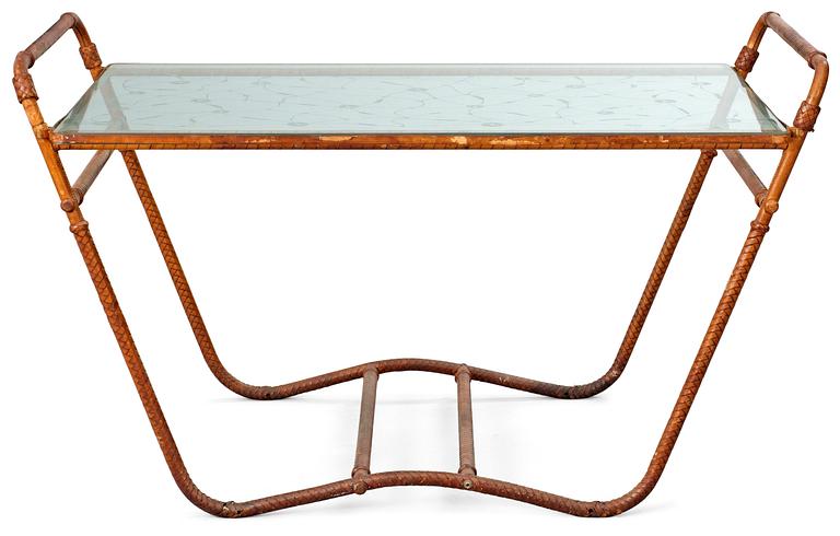 A tea table, 1940's-50's, metal frame, covered in brown leather straps, decorated glass top.