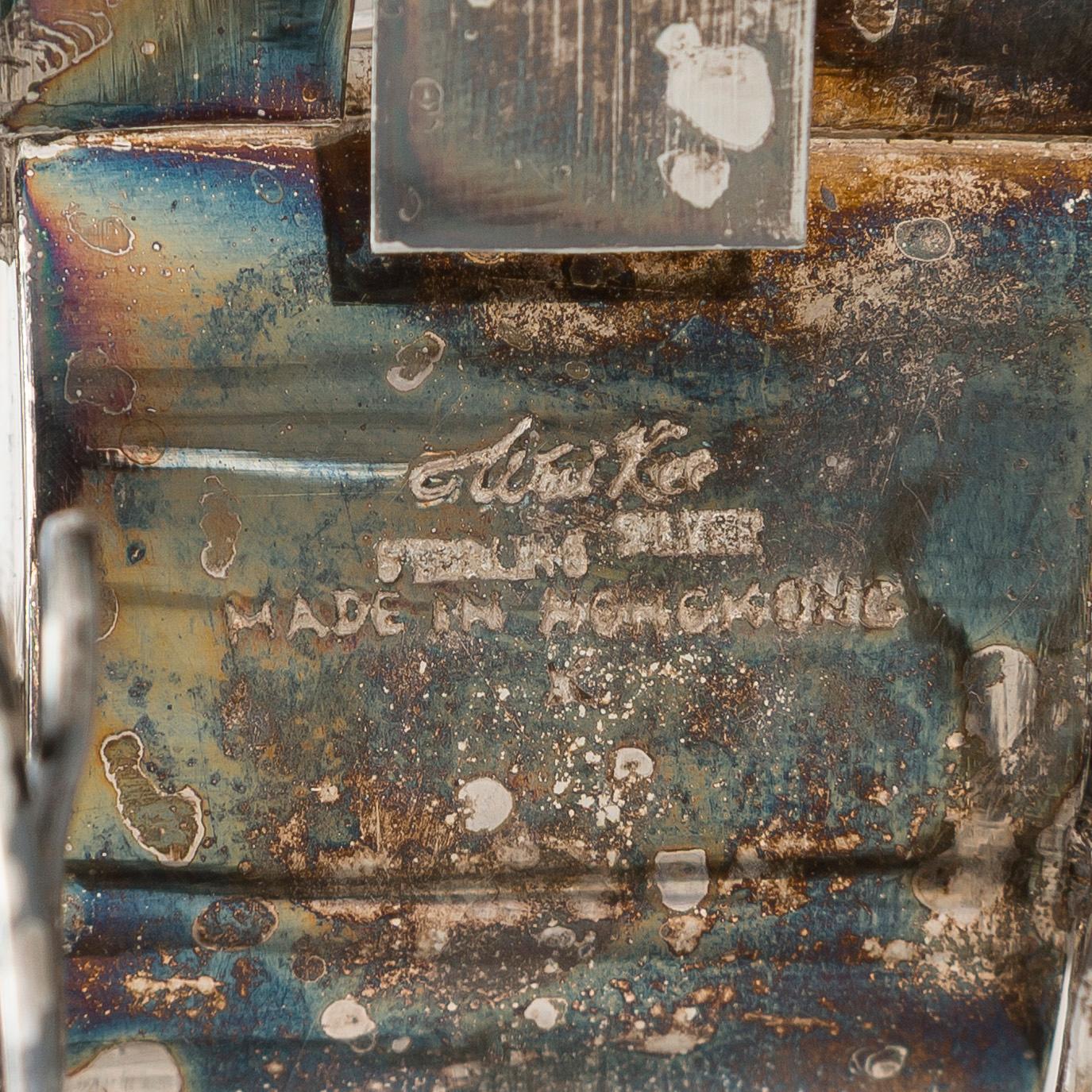 Four shakers in a pair of miniature rickshaws, sterling silver, maker's mark of Wai Kee, Hong Kong.