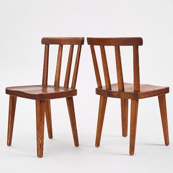 Axel Einar Hjorth, a set of six stained pine "Utö" chairs, Nordiska Kompaniet, Sweden, 1930s.