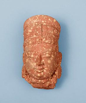 A mottled red sandstone head of Guanyin, Mathura, India, presumably 200-500 AD.