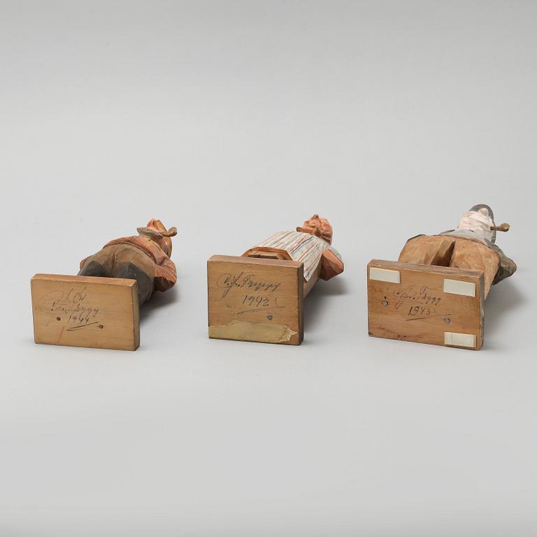 and CARL JOHAN TRYGG, three wooden sculptures, signed and dated, 1940s.