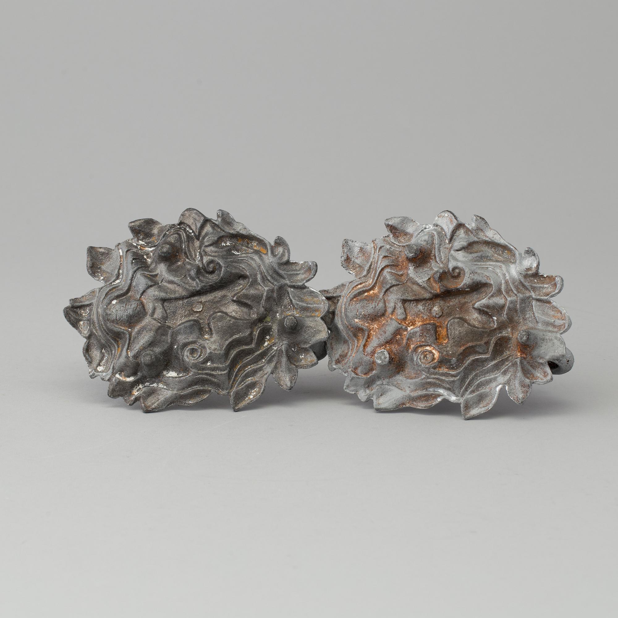 A pair of cast iron candlesticks, marked Verlag bei, A. Meves, Berlin, late 20th century.
