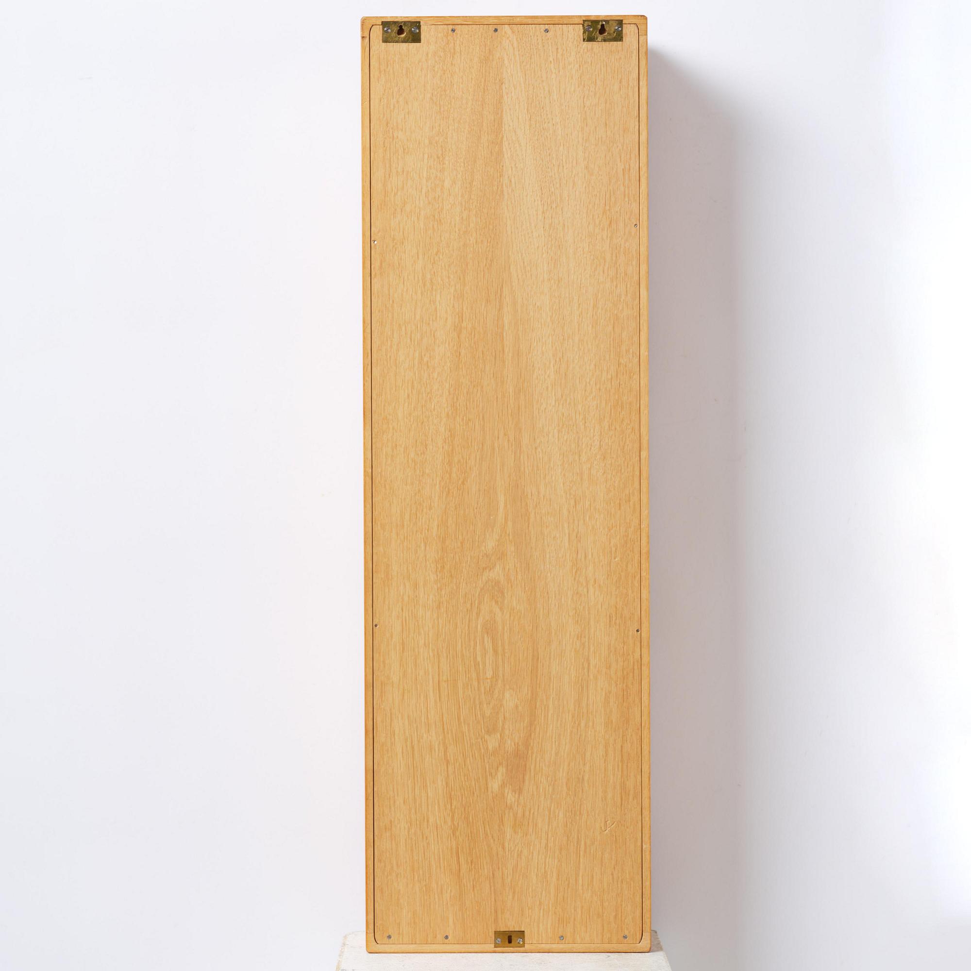 James Krenov, an oak or doussie showcase wall cabinet, executed in his own workshop, Bromma, Sweden.