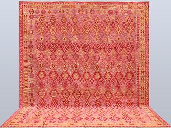 A Kilim carpet, c. 384 x 317 cm.