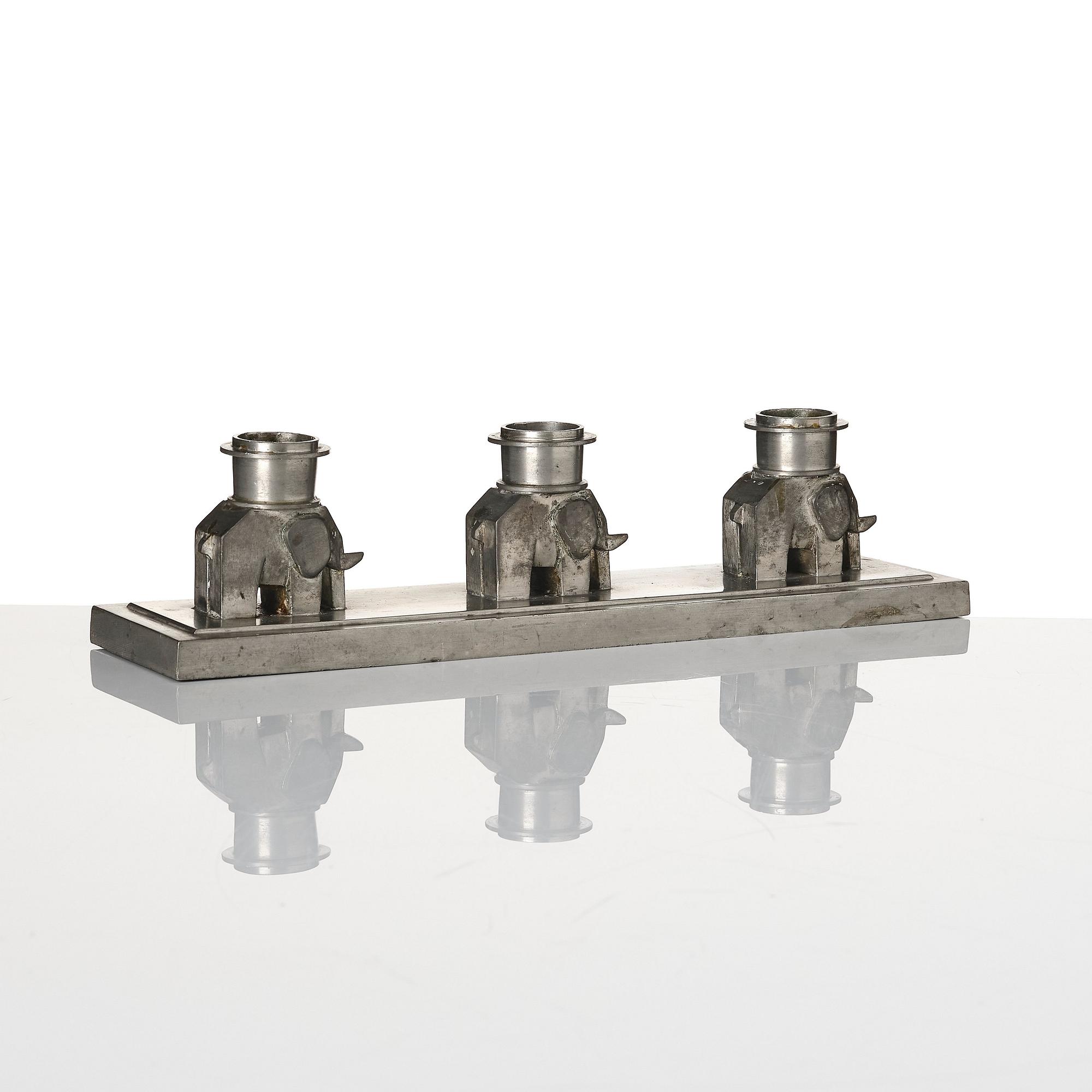 Lidvard Hallset, a pewter candelabrum for three candles, model "1545", Firma Svenskt Tenn, Stockholm 1930.