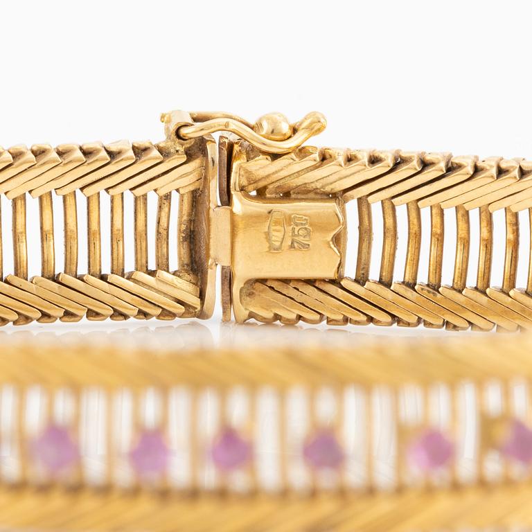 Bracelet 18K gold with pink stones.