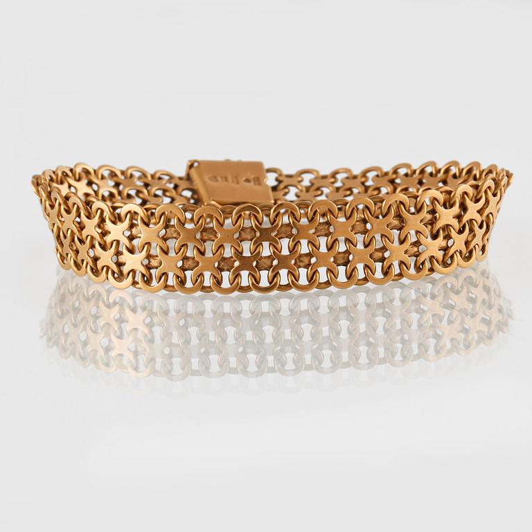 ARMBAND, 18K guld, M.K:S Guldsmedsatelier, Stockholm, 1962. Vikt 28g.