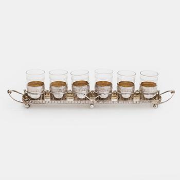 A set of six shot glasses with a tray in original fitted box, silver and glass, likely Norway 1910s.
