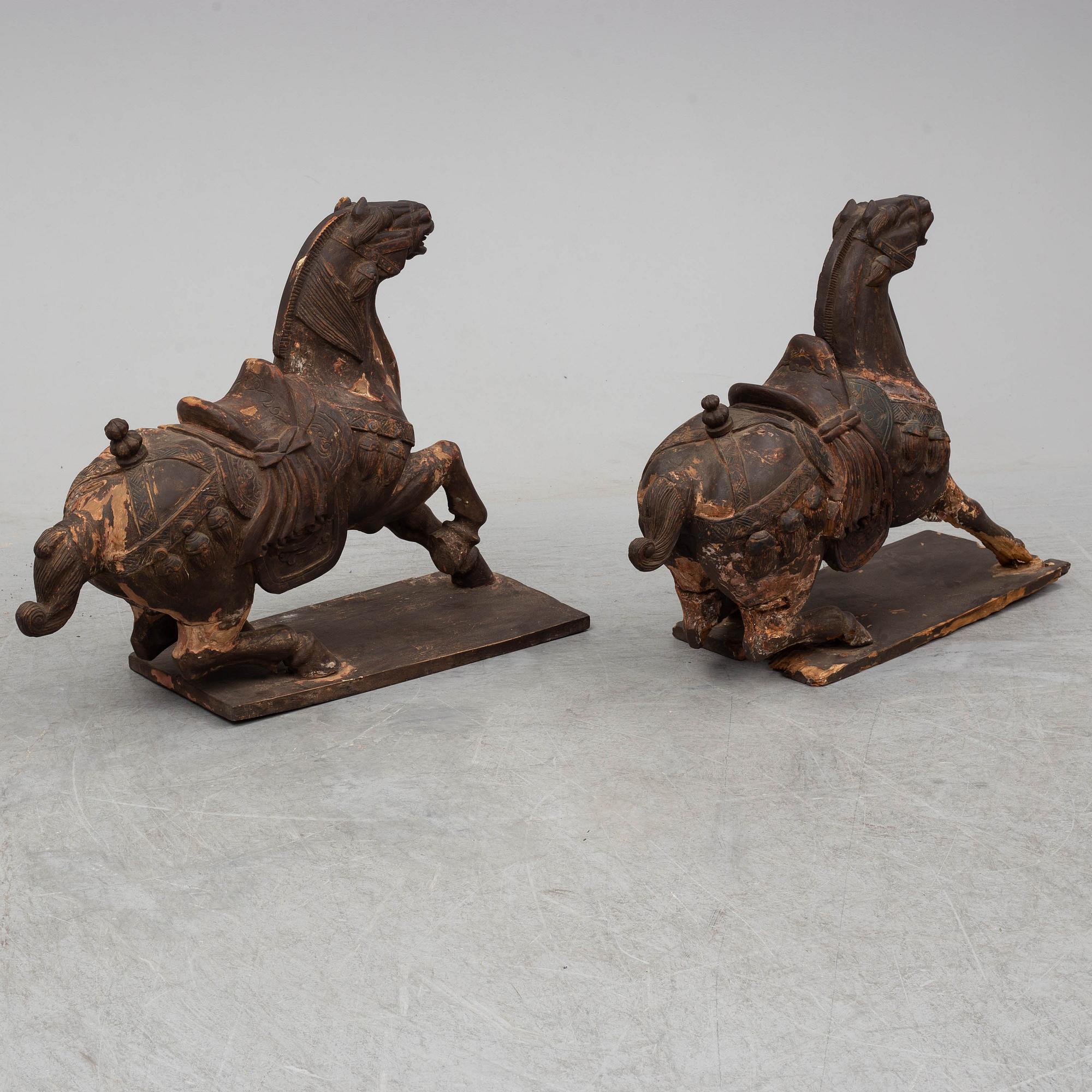 Two large wooden sculptures of horses, 20th century.