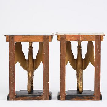 A pair of giltwood console tables, Empire-style incorporating older elements.