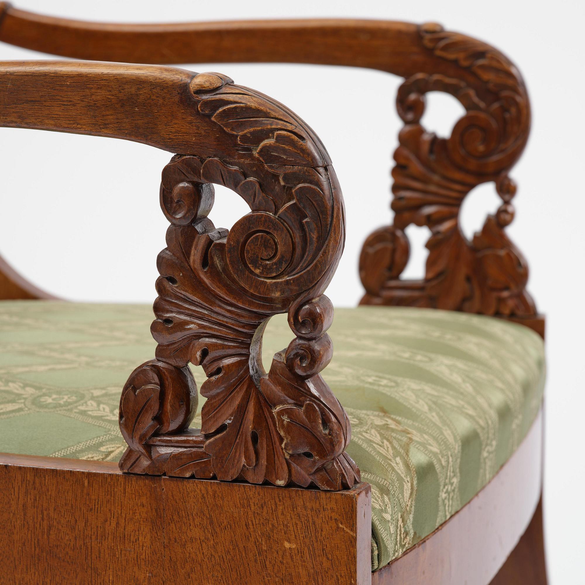 A pair of Baltic / Russian mahogany Empire armchairs, first part 19th century.