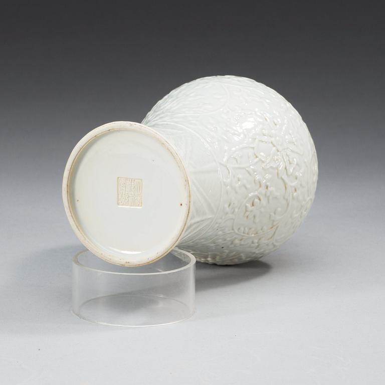 A white glazed vase, Qing dynasty with Qianlong seal mark.