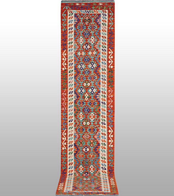 A Kelim runner, c. 389 x 93 cm.