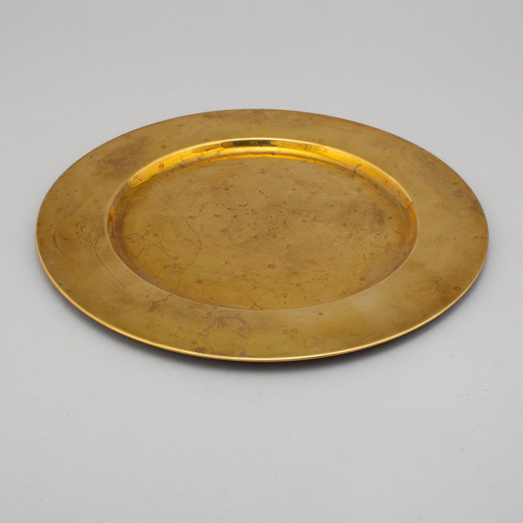 12 brass plates by Stelton, Denmark, second half of the 20th century.