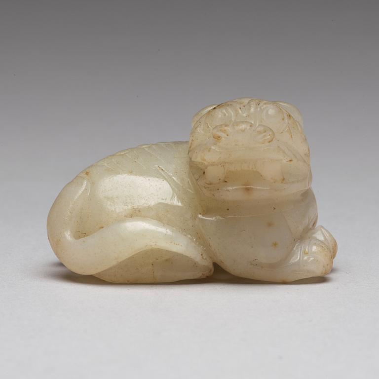 A Chinese nephrite snuff bottle, pendant and figurine.