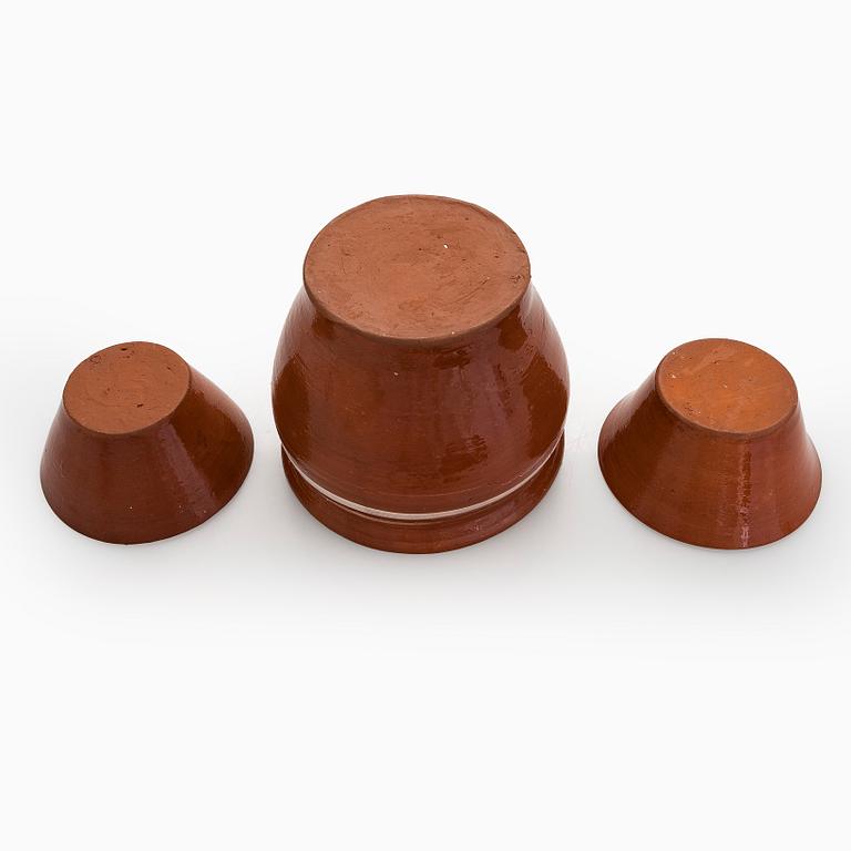 A set of ten redclay servingbowls.