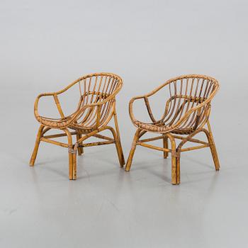 A PAIR OF RATTAN ARMCHAIRS.