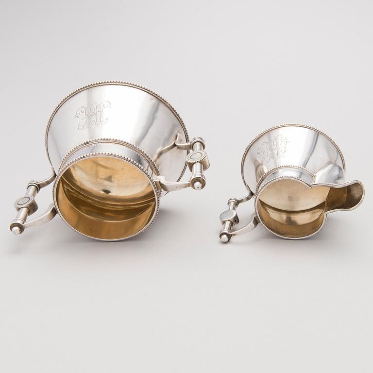 A similar silver sugar bowl and milk jug by Stefan Wäkevä, St.Petersburg 1891 and 1892.