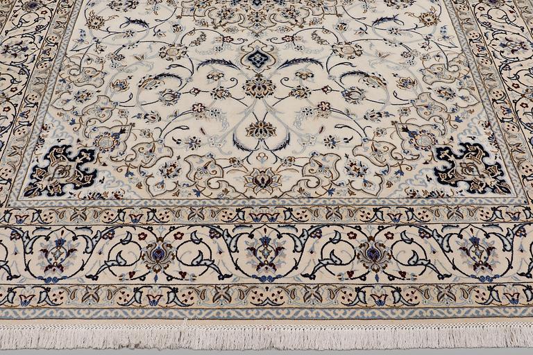 A Nain carpet, part silk, so-called 9 LAA, approx. 355 x 248 cm.