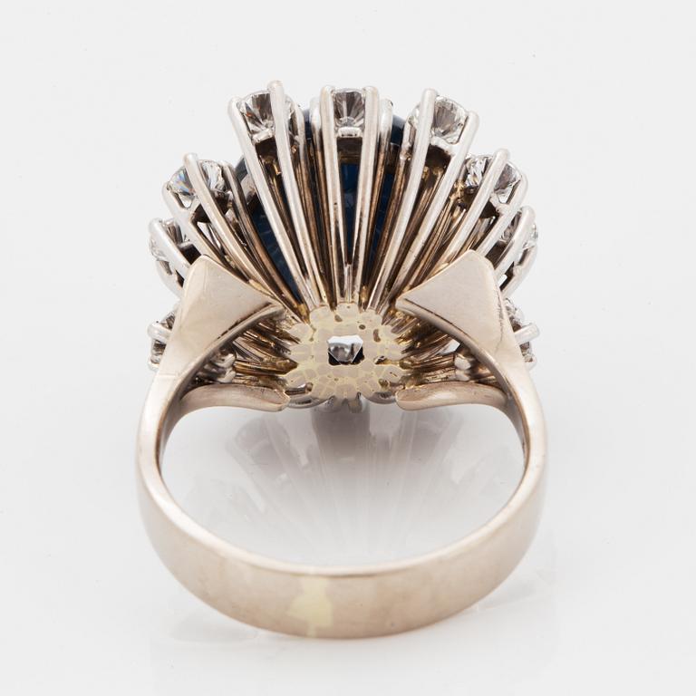 Cabochon-cut sapphire and brilliant-cut diamond cocktail ring.