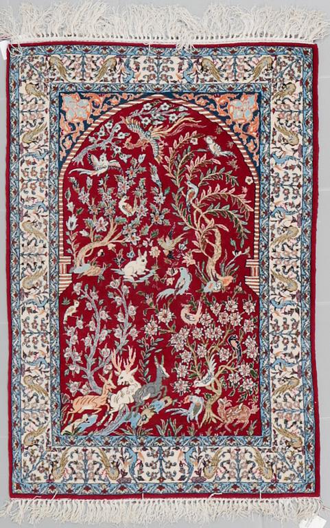 A Isfahan rug, possible, part silk, 122 x 83 cm.