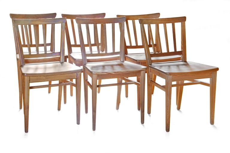 A SET OF SIX PINE DINNER CHAIRS,