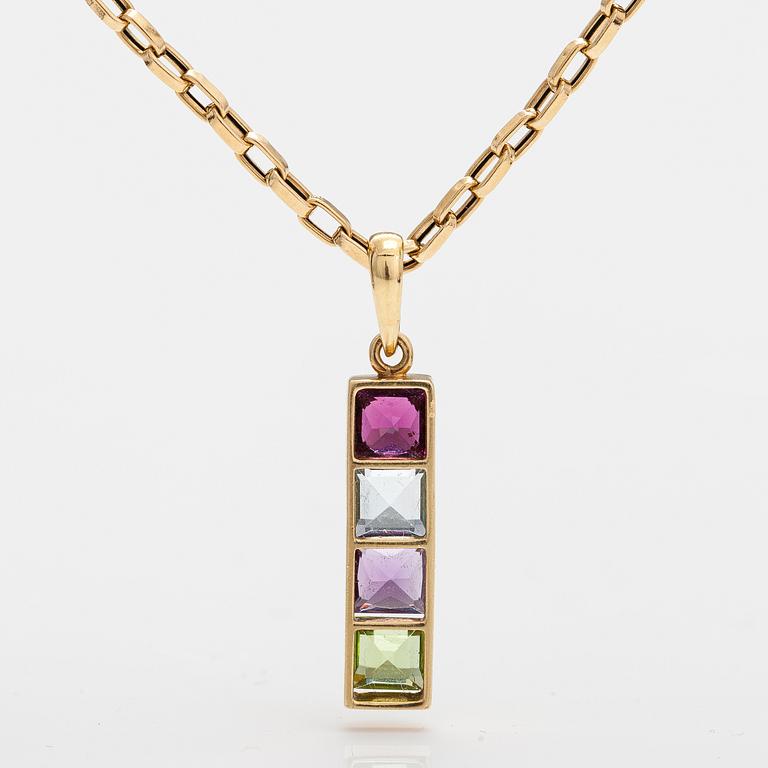 An 18K gold necklace with a garnet, peridote, amethyst and topaz.
