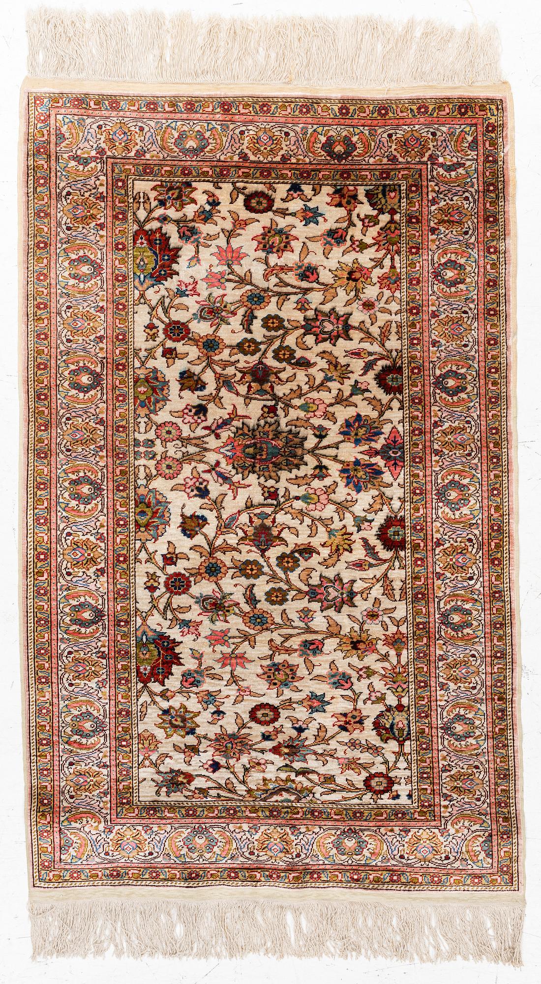 An Oriental silk rug, c. 122 x 76 cm.
