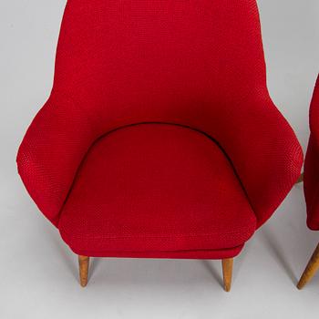 A pair of mid-20th century armchairs.