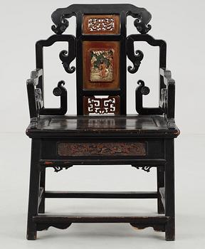 A black and red lacquered wooden chair, Qing dynasty.