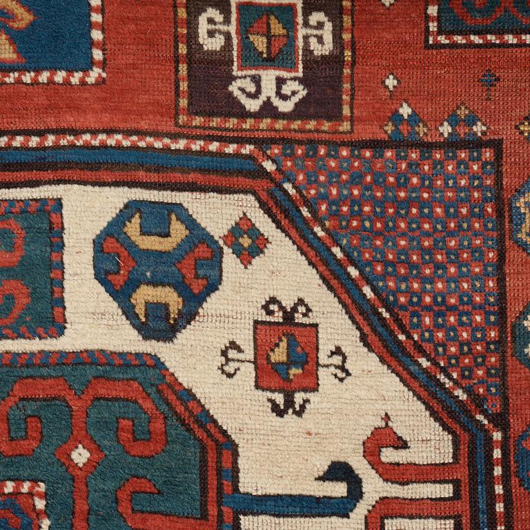 A RUG, an antique Karachop Kazak, ca 213 x 166 cm.