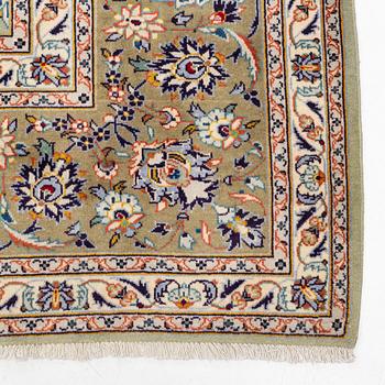 A semi-antique Kashan carpet, signed, circa 404 x 302 cm.