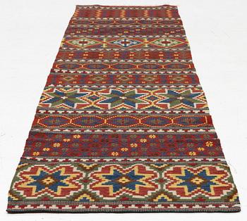 A bench cushion, flat weave, c. 262 x 64 cm, Scania, around the year 1900.