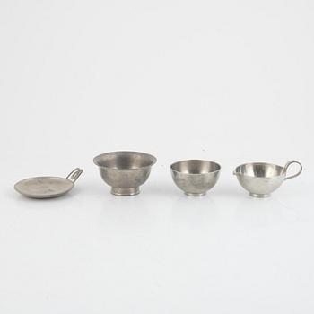 A pewter sugar bowl, cream jug, bowl and dish by Svenskt Tenn 1930s-1950s.