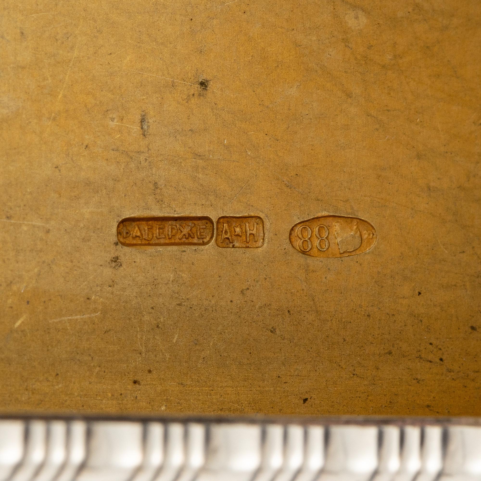 A Silver-gilt Fabergé Cigarette and Match Case, workmaster August Frederik Hollming, St. Petersburg 1908-1917.