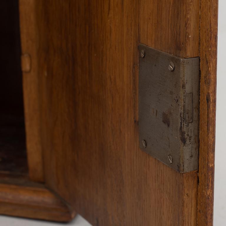 A wall cabinet, dated 1765.