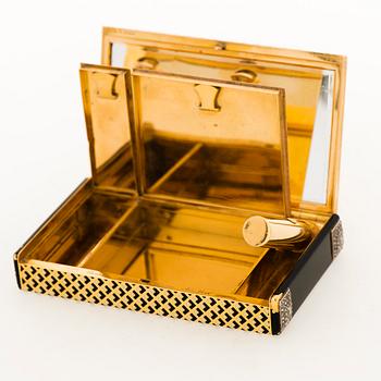 A Cartier Art Deco Vanity Case in 18K gold with enamel and baguette- and rose-cut diamonds.