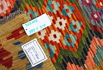 A Kilim carpet, c. 387 x 310 cm.