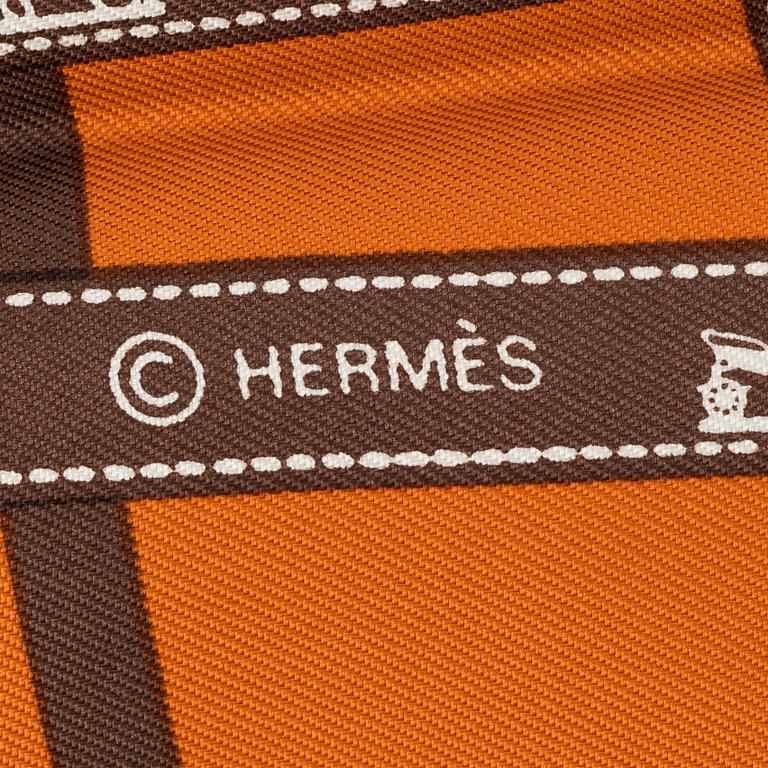 Hermès, a 'Jumbo' leather bracelet and a silk scarf.